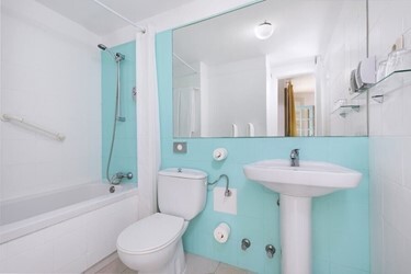 One bedroom with lounge pool side