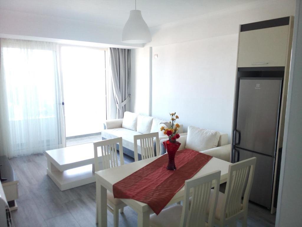 Фотографія Delfini Apartments апартаменты