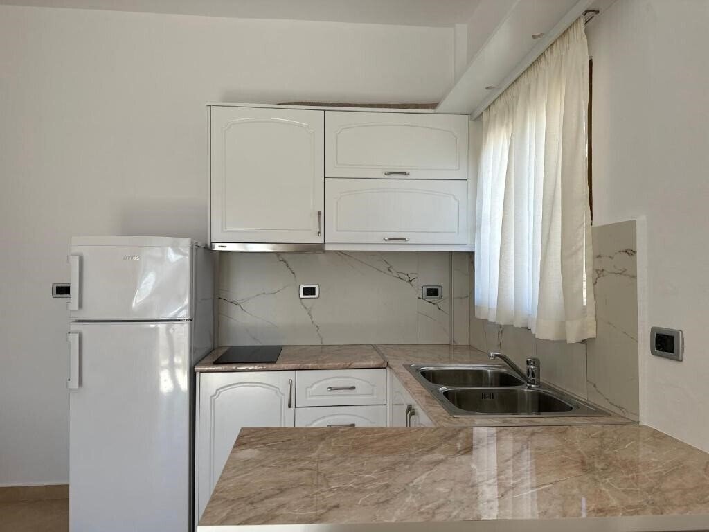 Картинка Rama Apartments апартаменты