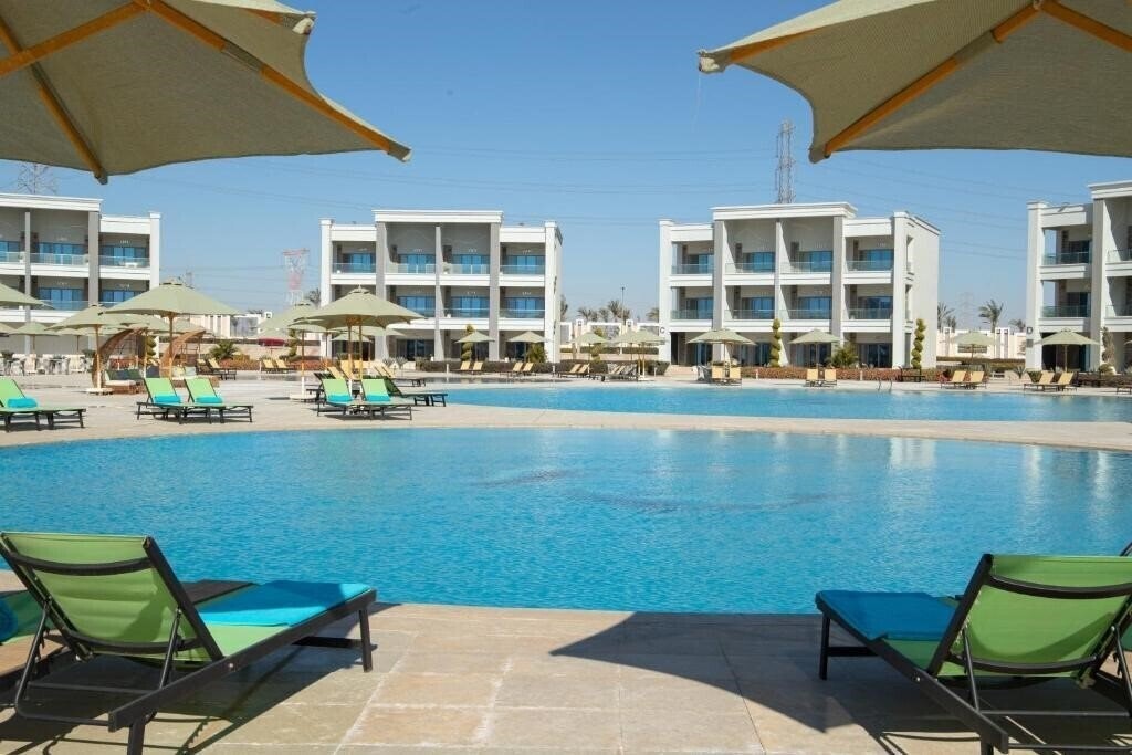 Фото Tolip Hotel Olympic International City 5*