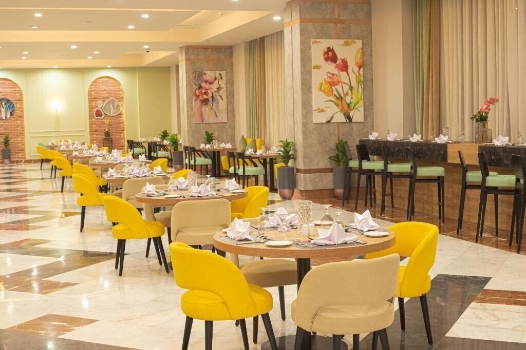 Фотографія Tolip Hotel Olympic International City 5*