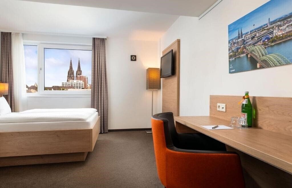 Фото Stadthotel Am Romerturm 4*