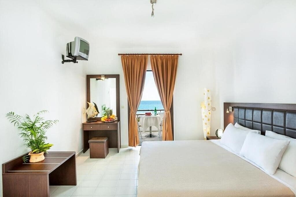 Фото Xenios Dolphin Beach 3*