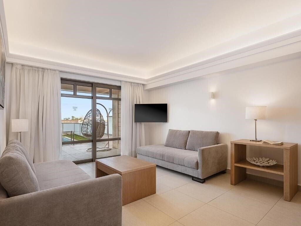 Фото Porto Platanias Beach Resort & SPA 5*