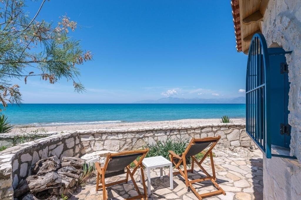 Фотографія Kyma Suites Acharavi 4*