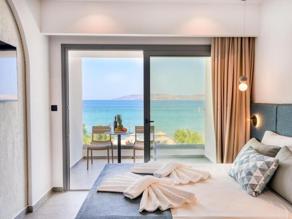 Отель Seaside Beach Marmari Hotel 4*
