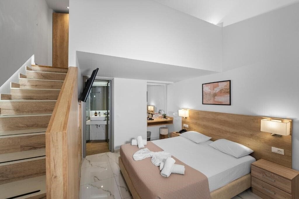 Фото Marvel Deluxe Rooms 4*