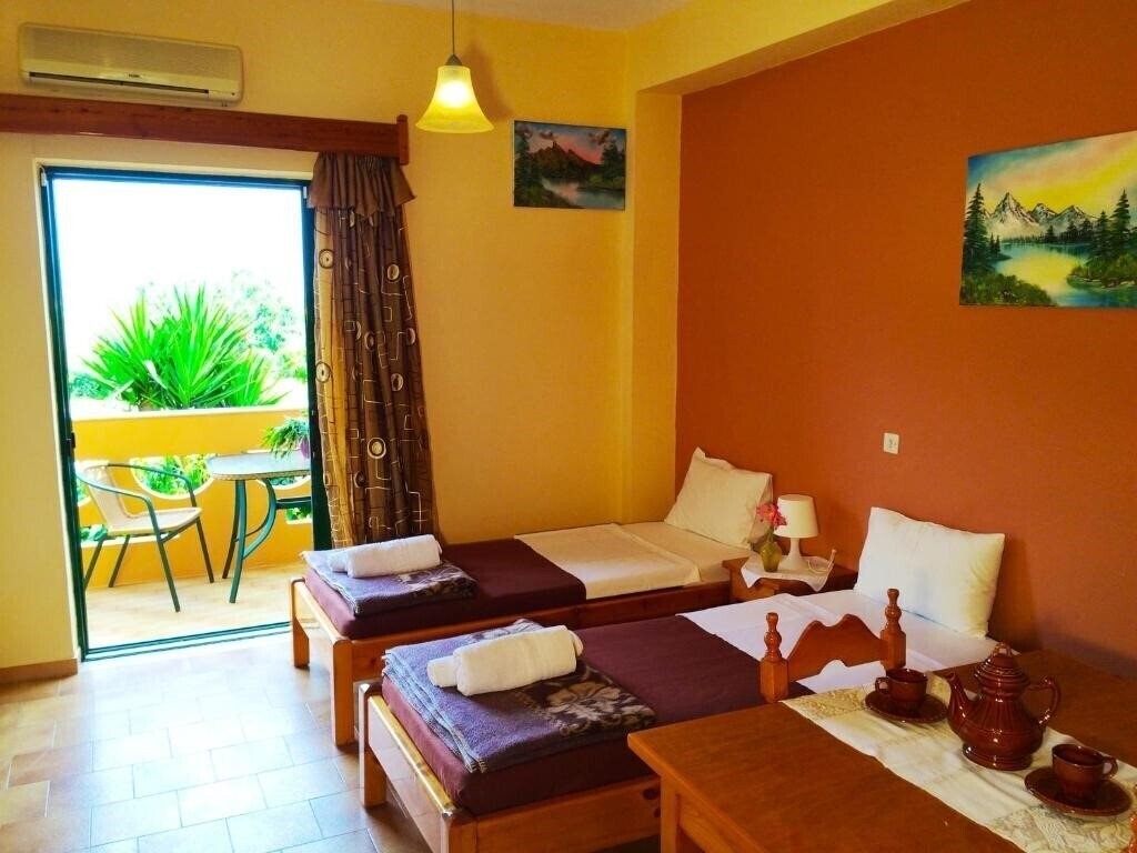 Фотография Chrissas Beach Apartments - Hotel Rooms & Apartments 3*