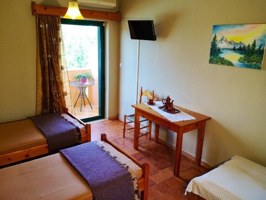 Изображение Chrissas Beach Apartments - Hotel Rooms & Apartments 3*