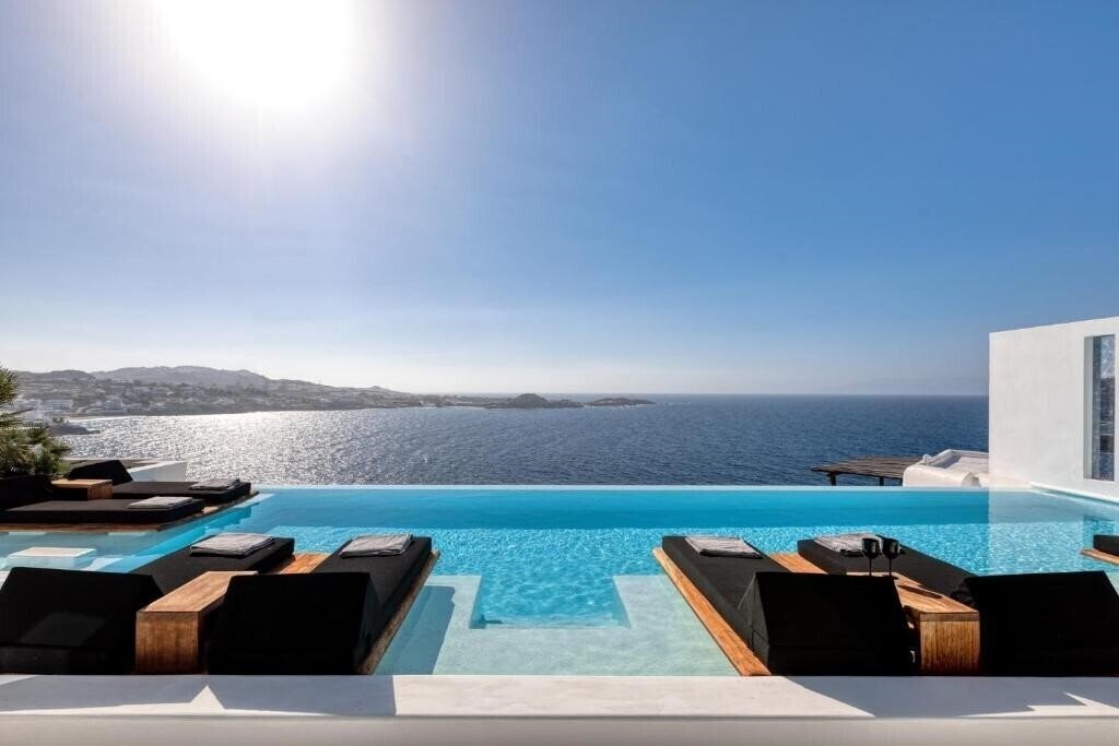 Отель Psarou Black Villa 5*