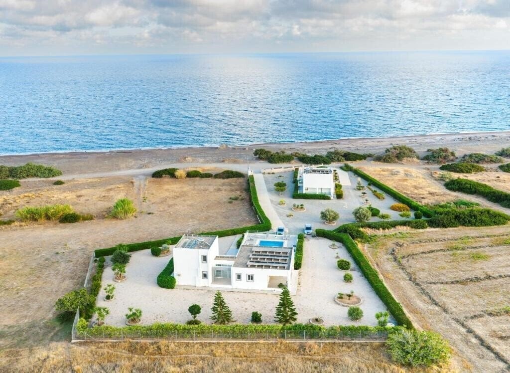 Отель Aegean Horizon Beachfront Villas 5*
