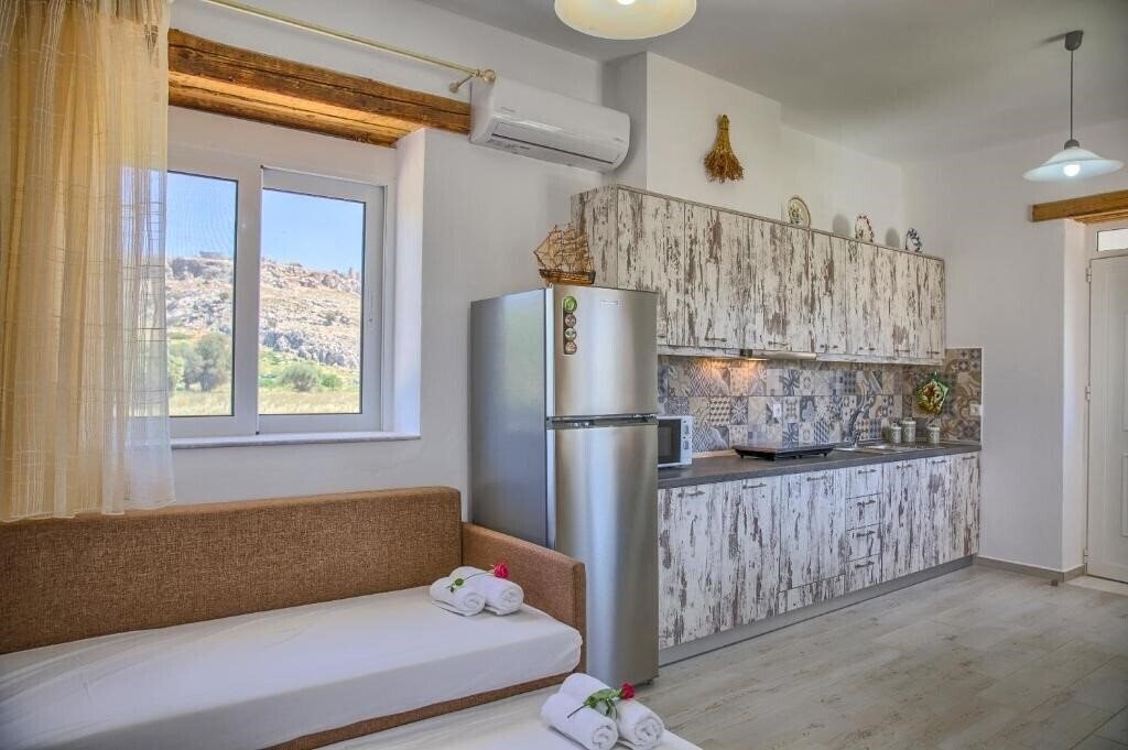 Фотография Haraki Stone Apartments 3*