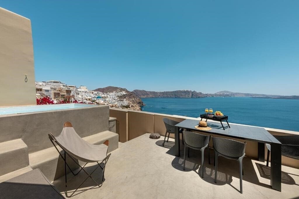 Отель Caldera Houses Oia 4*