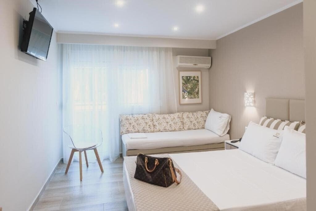 Фотографія Ammos Beach Seaside Luxury Suites 4*
