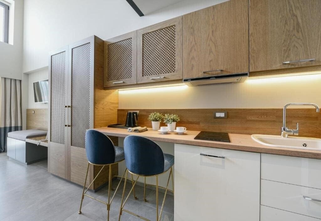 Фотографія Serenity Suites 4*