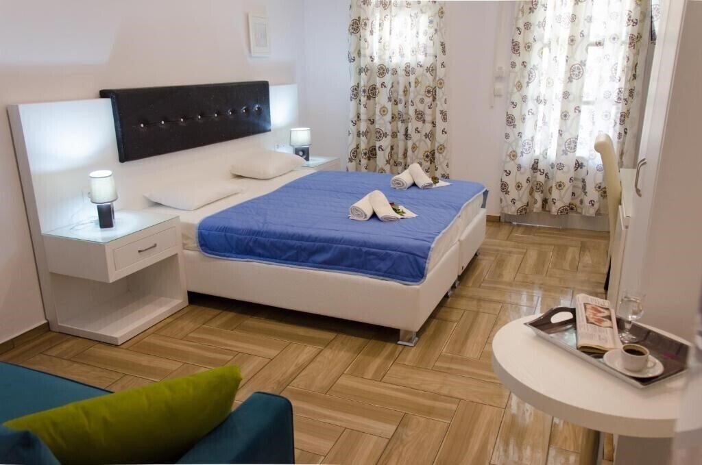 Фото Polykratis Rooms Apart Hotel 4*
