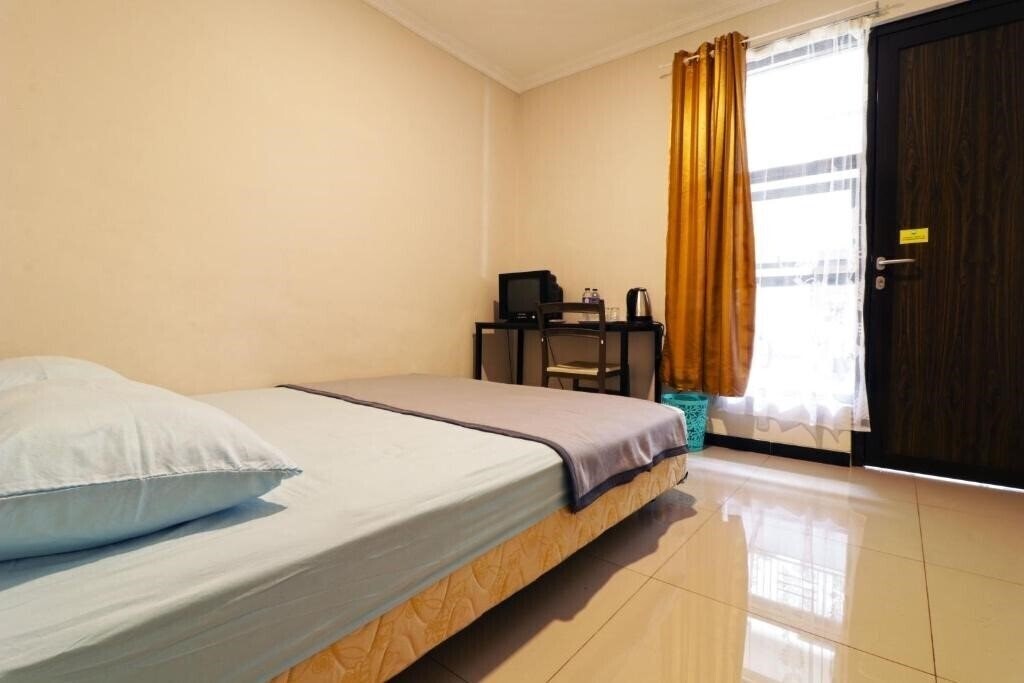 Фото Wisma Surya By Zuzu 3*