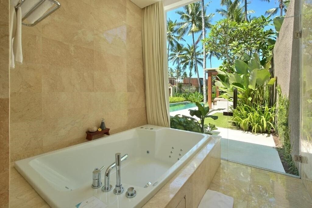Фото Candi Beach Cottage 4*