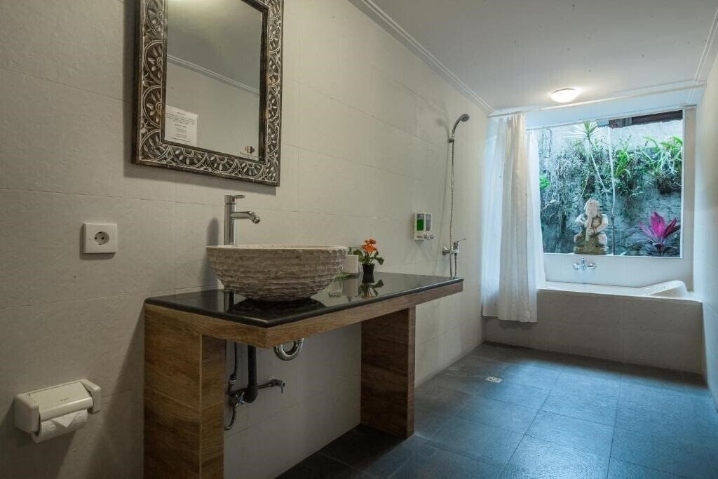 Фото Taman Harum Cottages 3*