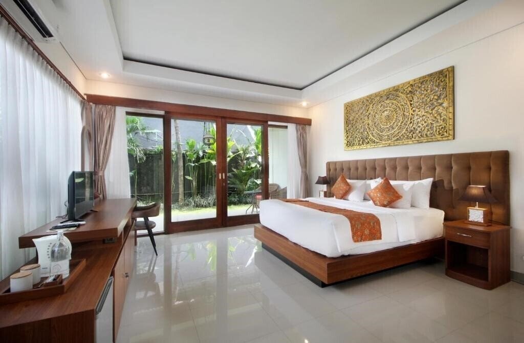 Фото Putri Ayu Cottages 3*