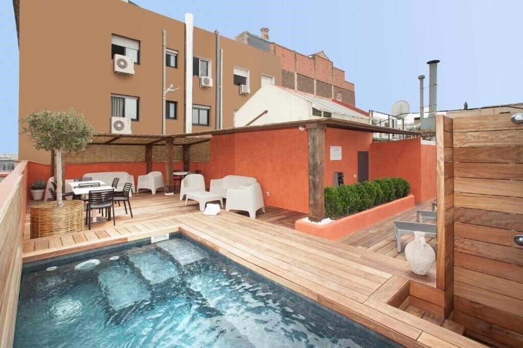 Фотография Enjoybcn Colon Apartments 4*