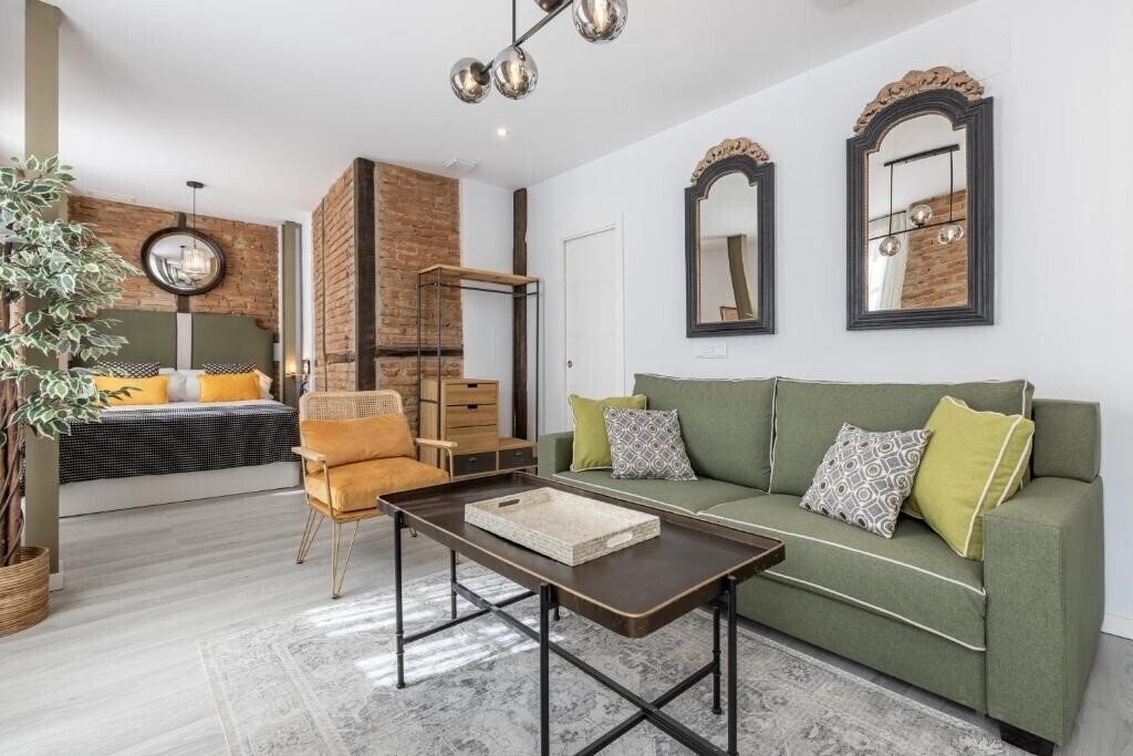 Фото Apartamentos Puerta Elvira Suites 3000 3*