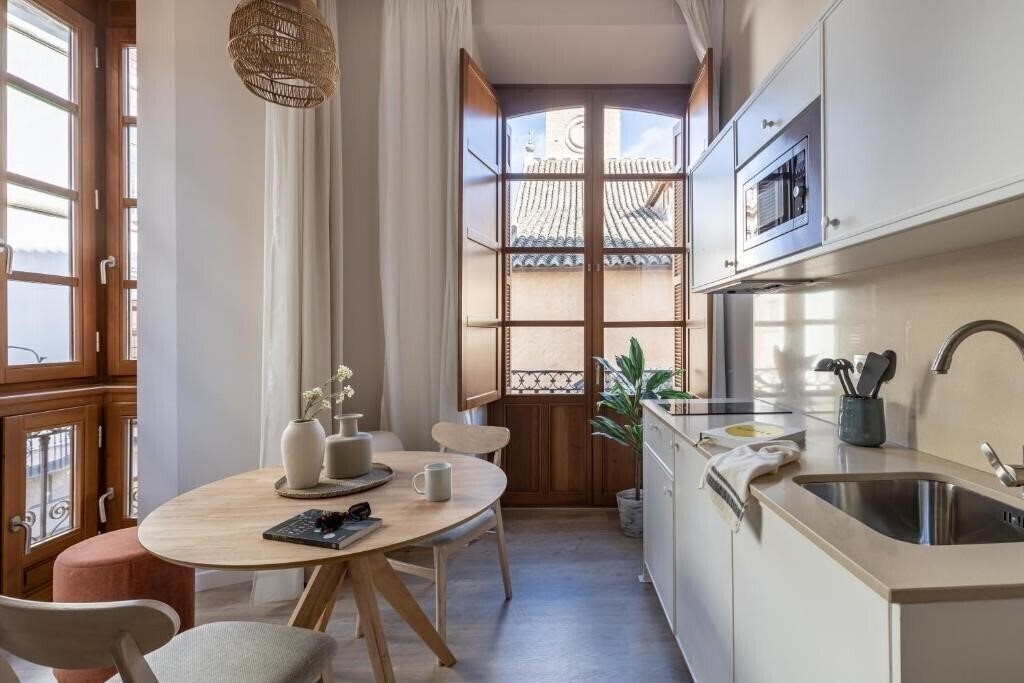 Фотографія Apartamentos Libere Malaga Teatro Romano 4*