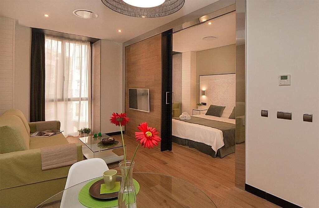 Фото Apartamentos Suites Oficentro Deluxe 4*