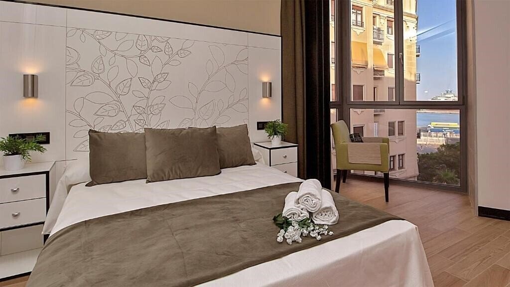 Фотография Apartamentos Suites Oficentro Deluxe 4*