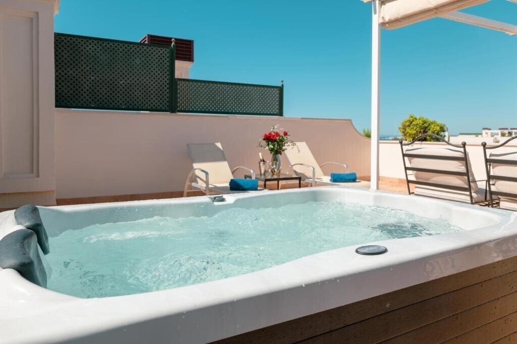 Фотография Apartamentos Guadalpin Suites 3*