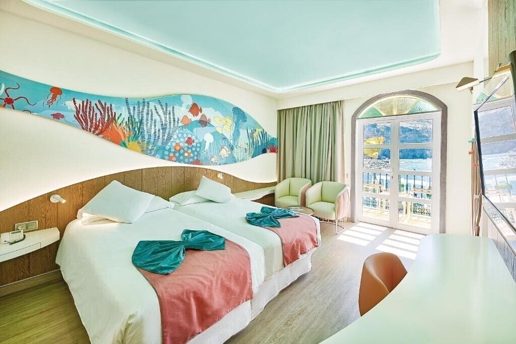 Фото Livvo Puerto de Mogan 4*