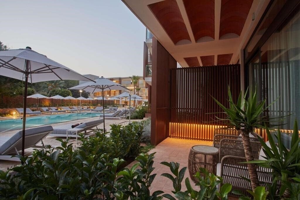 Фото The Club Cala San Miguel Hotel Ibiza, Curio Collection by Hilton 5*
