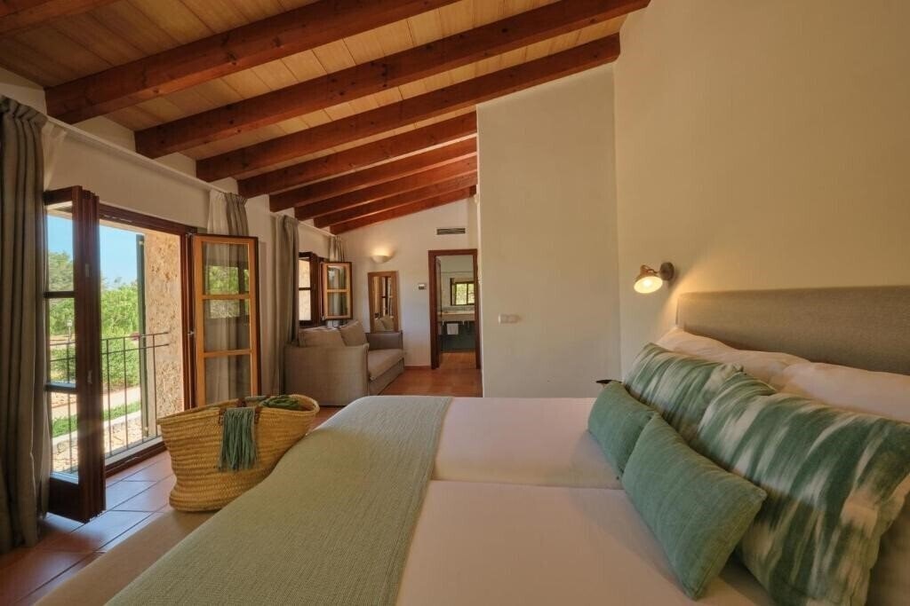 Фото Hotel Rural Es Riquers (Porreras) 3*