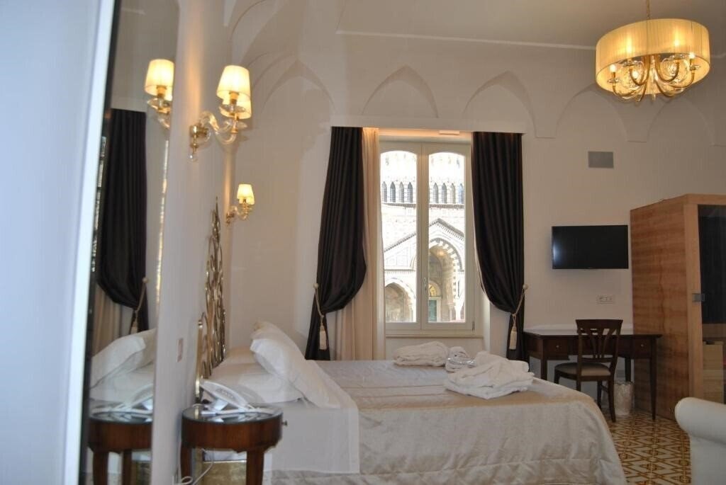 Фотографія Core Amalfitano City Suites 5*