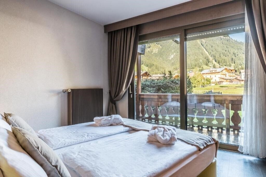 Фото Residence Anda Pozza di Fassa 4*