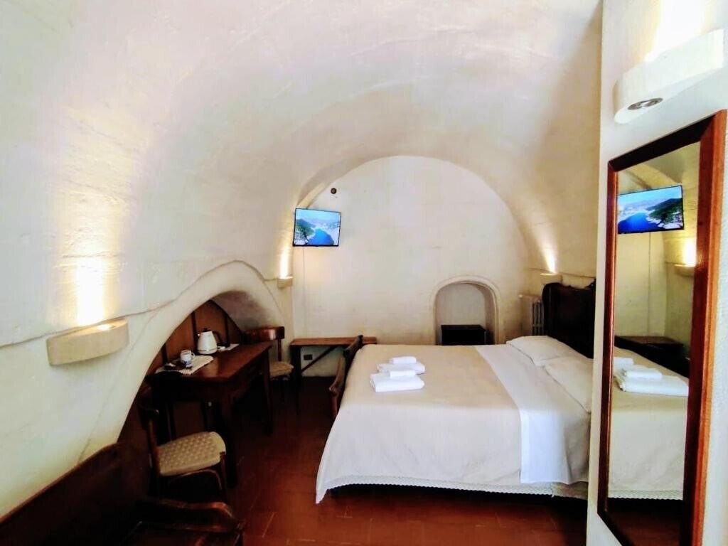 Фотография Cave Rooms Sassi 3*