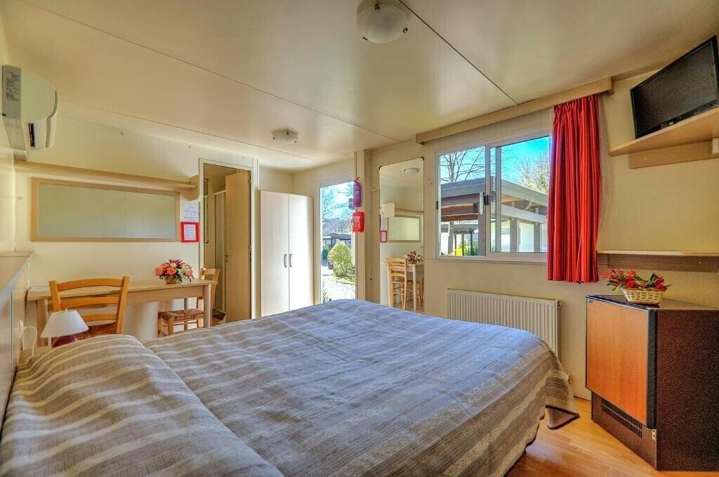 Фото Flaminio Village Bungalow Park 4*