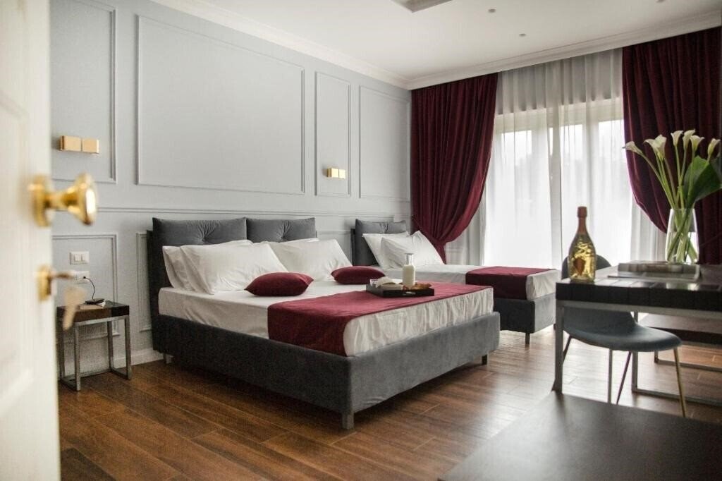 Отель Unicum Roma Suites 2*