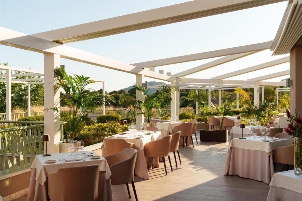 Фотография Baia di Chia Resort Sardinia Curio Collection by Hilton 5*