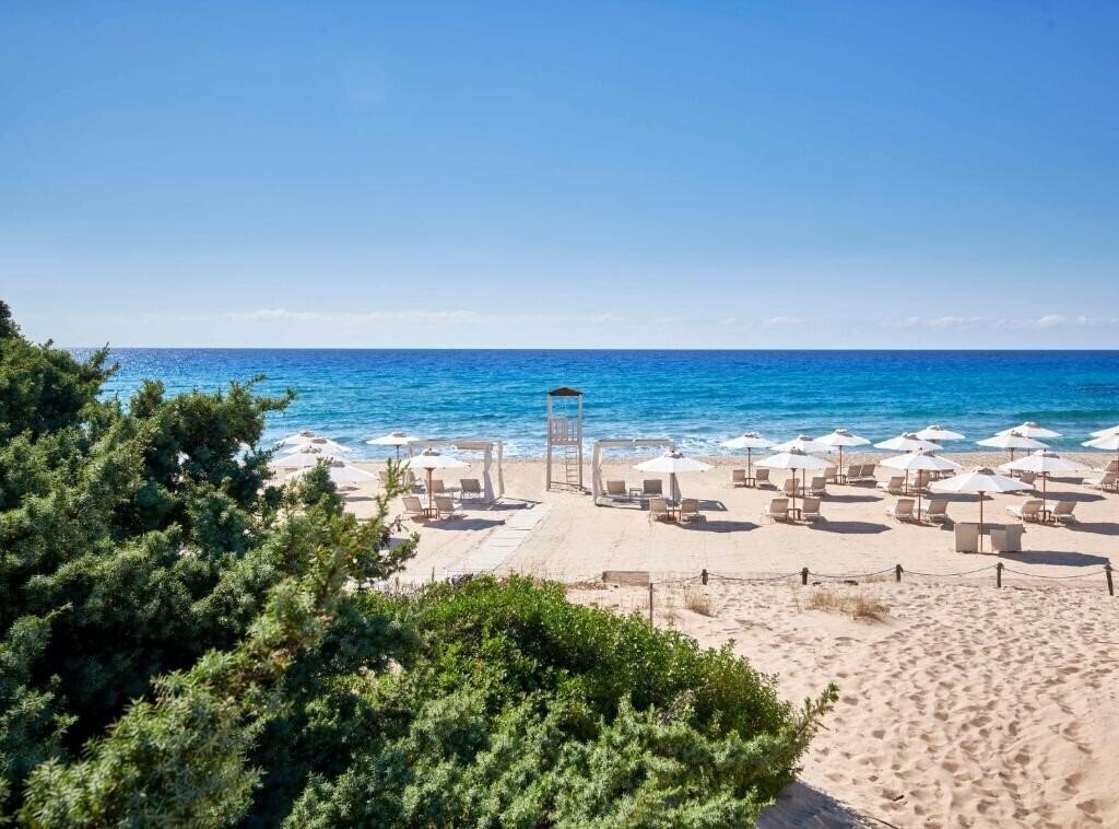 Картинка Baia di Chia Resort Sardinia Curio Collection by Hilton 5*