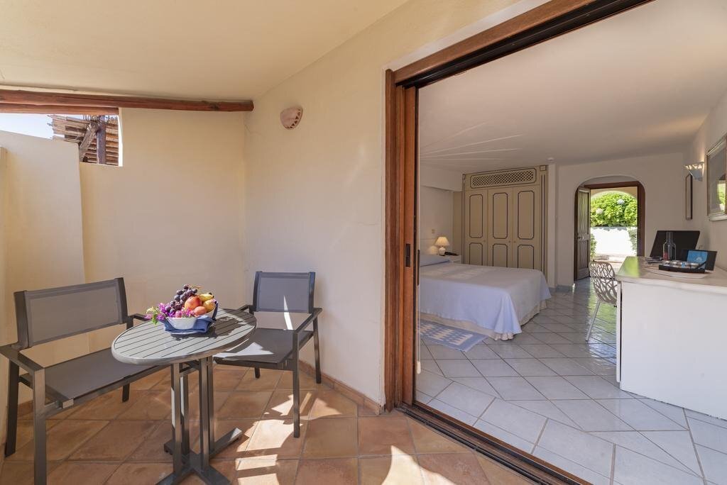 Фотографія Club Hotel Baja Sardinia 4*