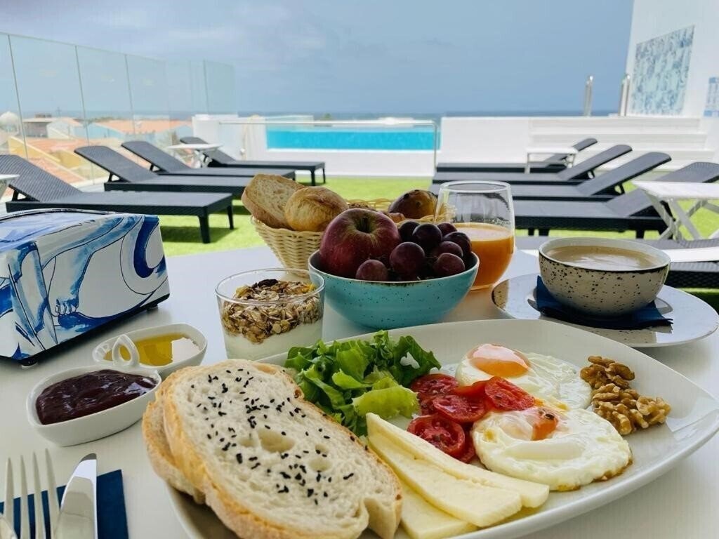 Фотография Design Suites Boutique Hotel - Adults Only 4*