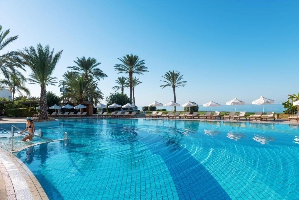 Фото Constantinou Bros Athena Beach Hotel 4*