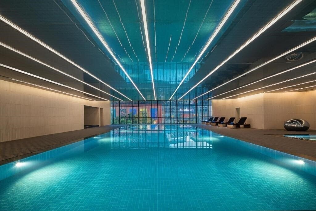 Фотография Hualuxe Shanghai Changfeng Park, an IHG Hotel 5*