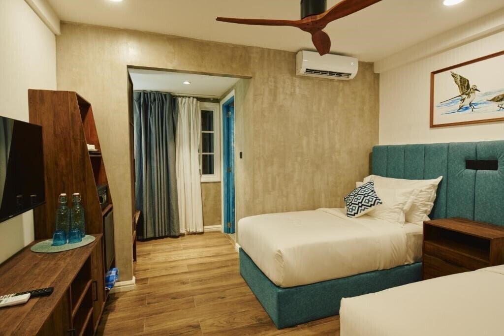 Изображение Beach Hotel Dhigurah Guest House 4*