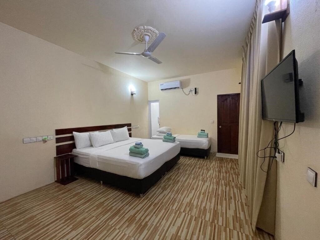 Картинка Shoreline Grand Thoddoo Guest House гостиный двор