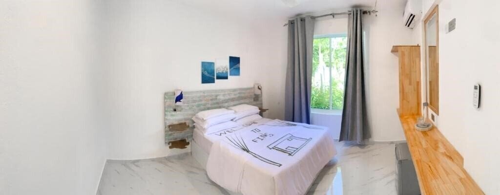 Фото Fins Dive And Leisure Hotel Guest House гостиный двор