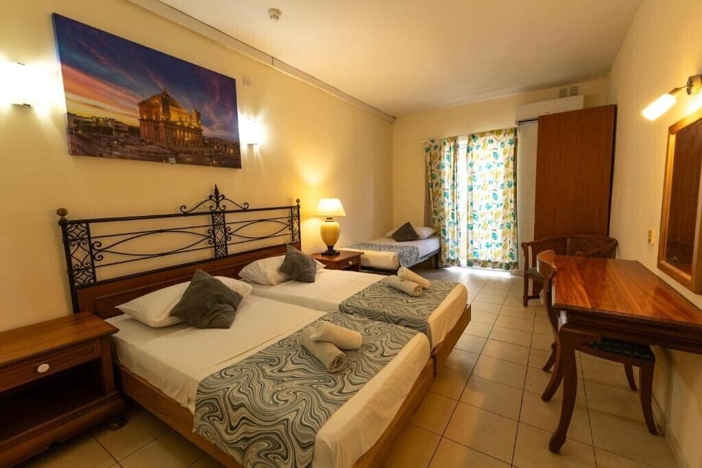 Фото Qawra Inn Hotel 4*