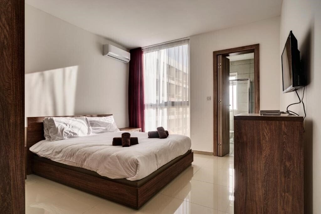 Фото The Village Apartments 3*