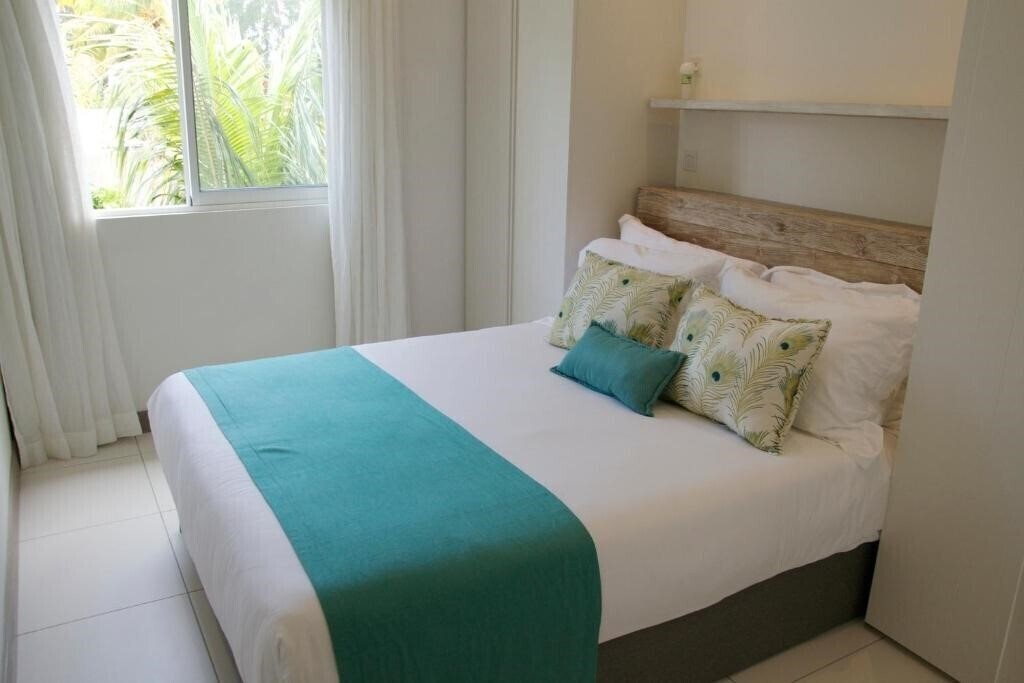 Фотографія Summer Breeze Beachfront Luxury Apartment Pointe d'Esny 4*
